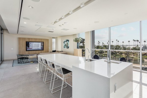 Clubhouse featuring contemporary design and communal seating at Valentina by Alta Apartments