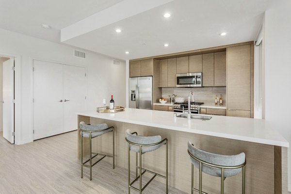 Modern kitchen with stainless steel appliances at Valentina by Alta Apartments
