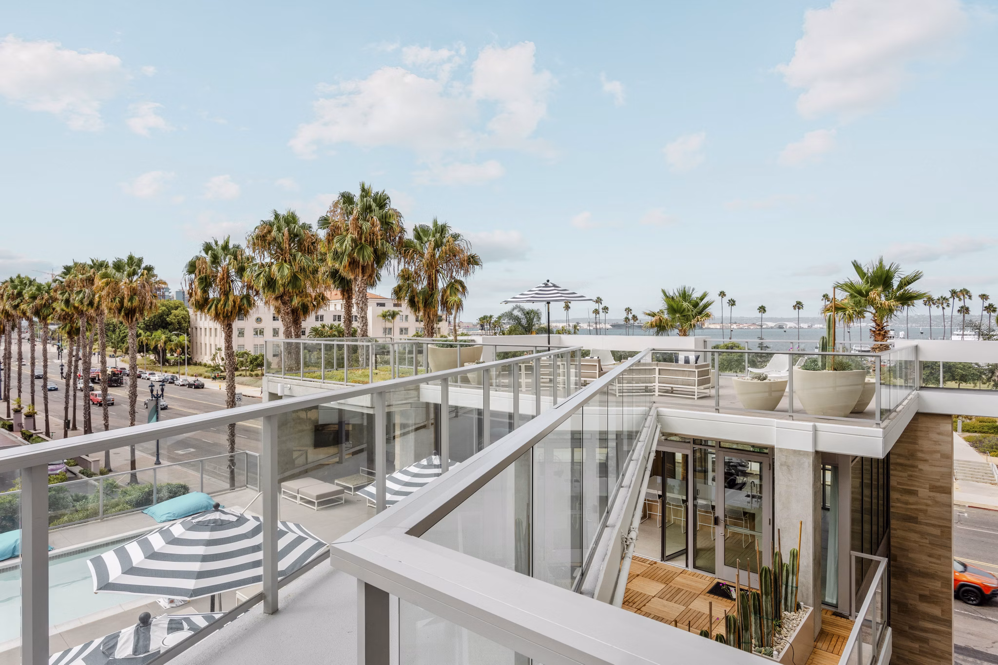 Valentina by Alta Apartments: Stylish patio with modern seating and ocean views