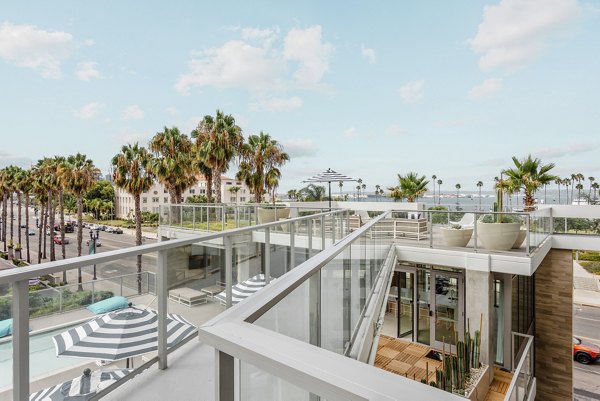 Valentina by Alta Apartments: Stylish patio with modern seating and ocean views