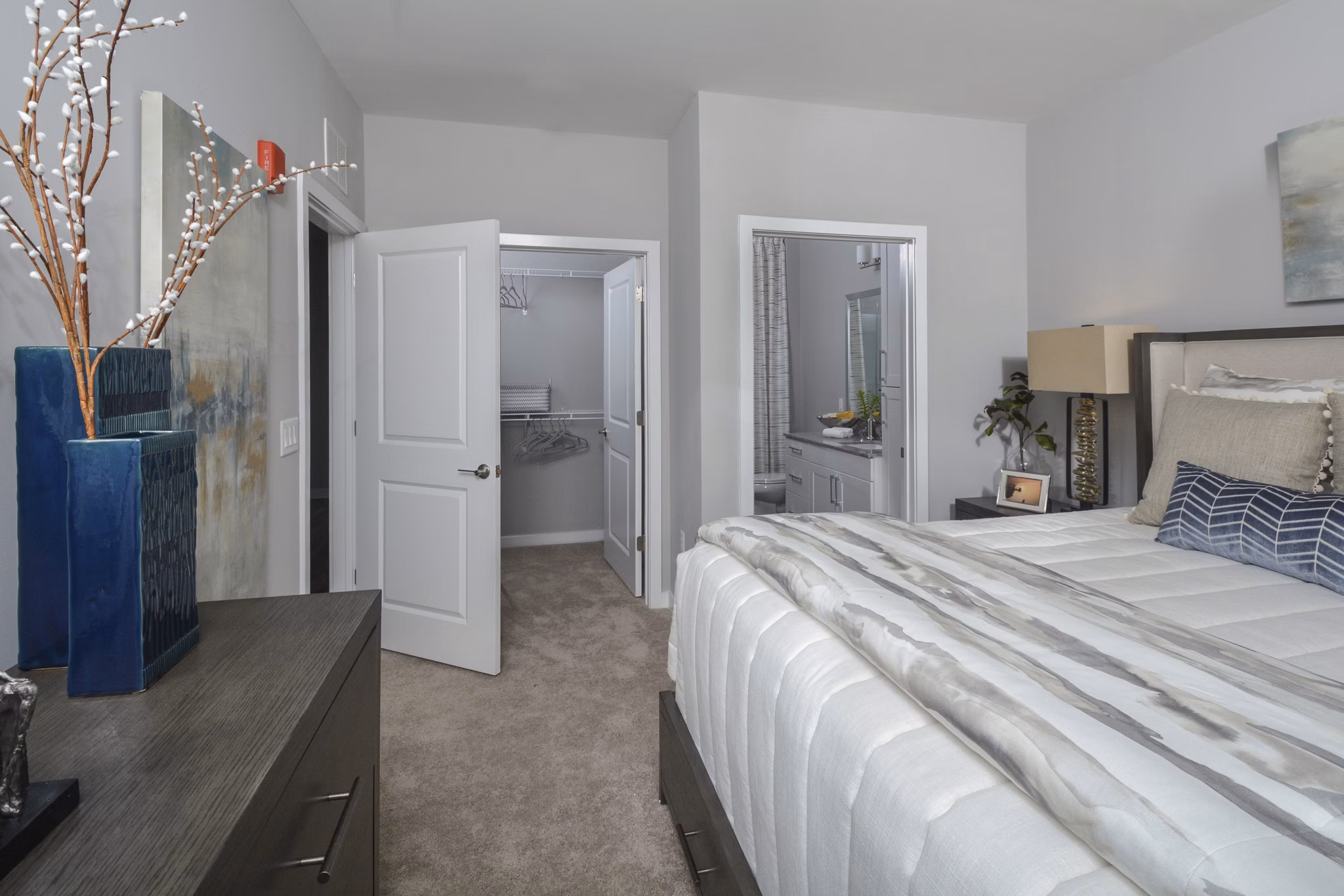 Modern bedroom with stylish furniture at The Wexley at 100 Apartments
