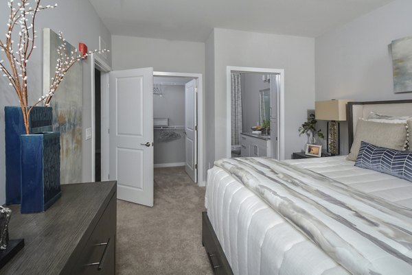 Modern bedroom with stylish furniture at The Wexley at 100 Apartments