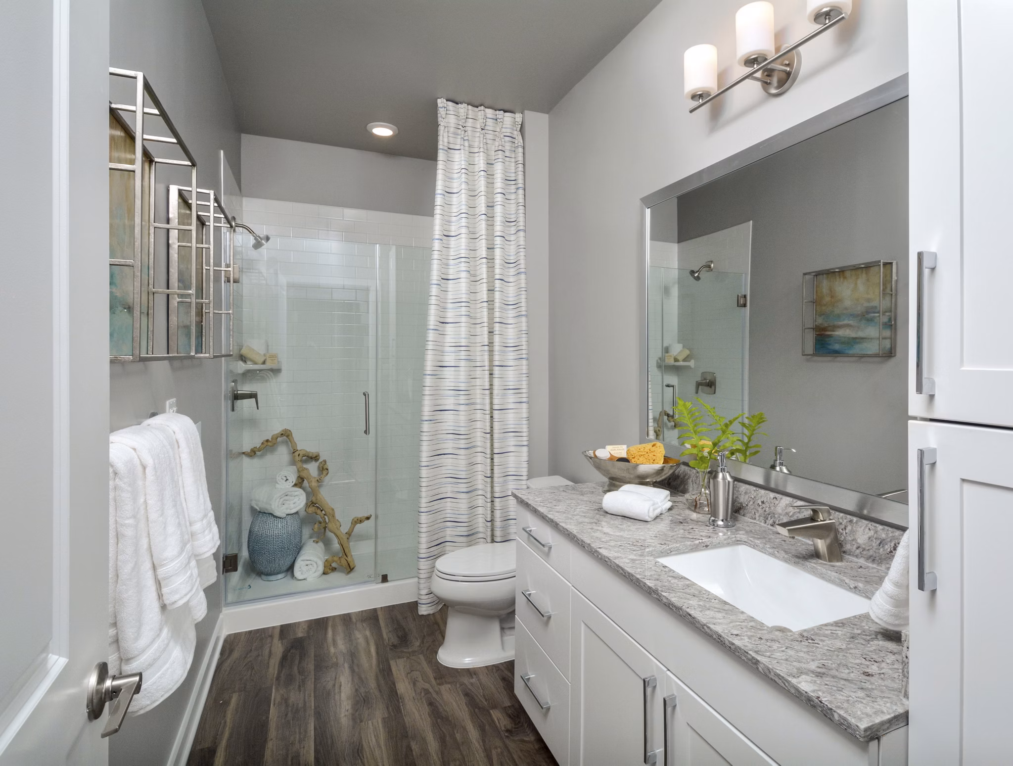 The Wexley at 100: Elegant bedroom with king-sized bed and large windows in luxury apartment