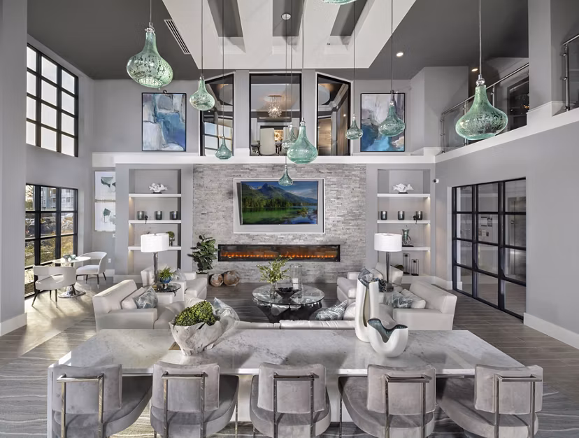 Contemporary clubhouse with comfortable seating and modern decor at The Wexley at 100 Apartments