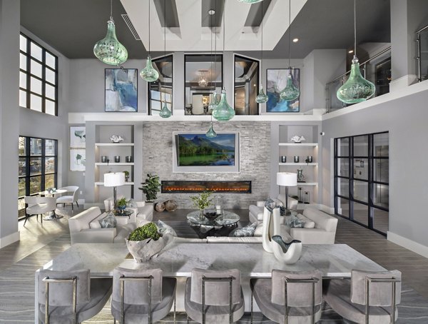 Contemporary clubhouse with comfortable seating and modern decor at The Wexley at 100 Apartments