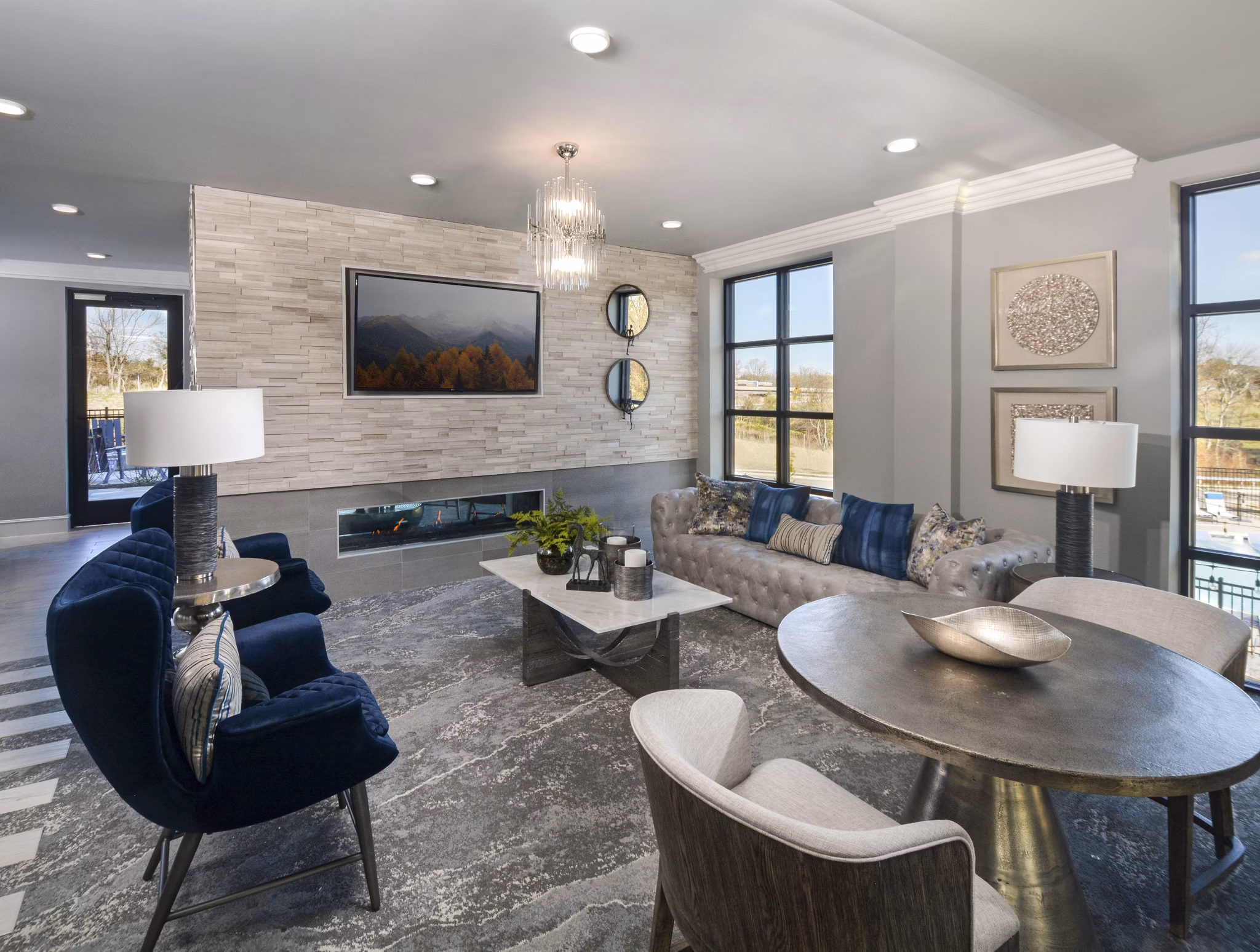 Modern clubhouse with plush seating and billiards at The Wexley at 100 Apartments