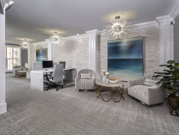 Clubhouse featuring modern lounge and sleek decor in The Wexley at 100 Apartments