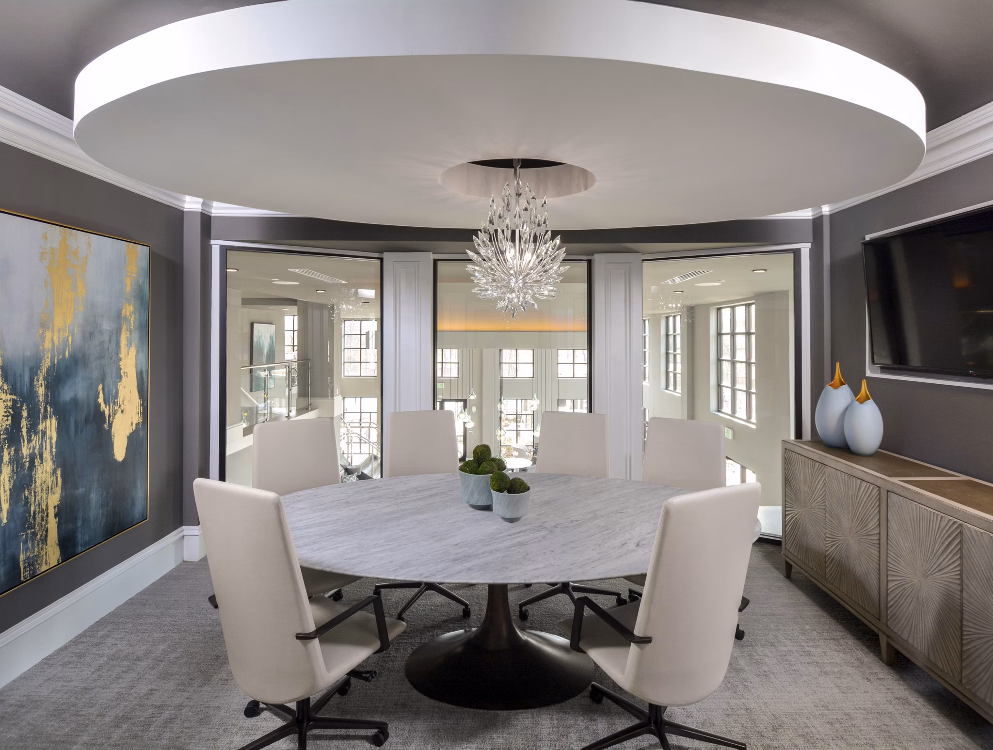 Spacious clubhouse featuring modern decor and seating at The Wexley at 100 Apartments