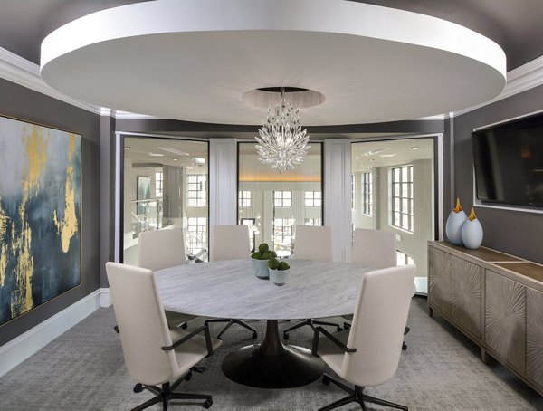 Spacious clubhouse featuring modern decor and seating at The Wexley at 100 Apartments