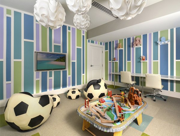 Clubhouse featuring elegant seating and billiards at The Wexley at 100, luxury apartments in urban locale