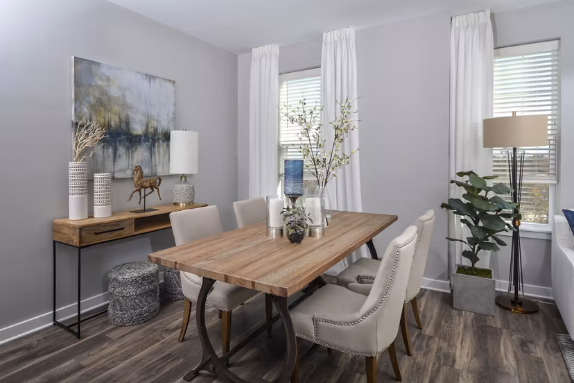 Spacious dining area with stylish lighting and modern furniture at The Wexley at 100 Apartments