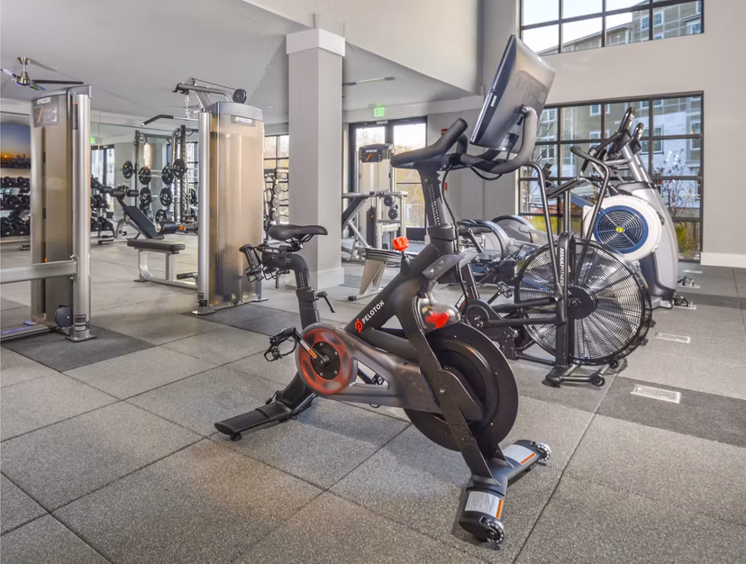 Fitness center with state-of-the-art equipment at The Wexley at 100 Apartments