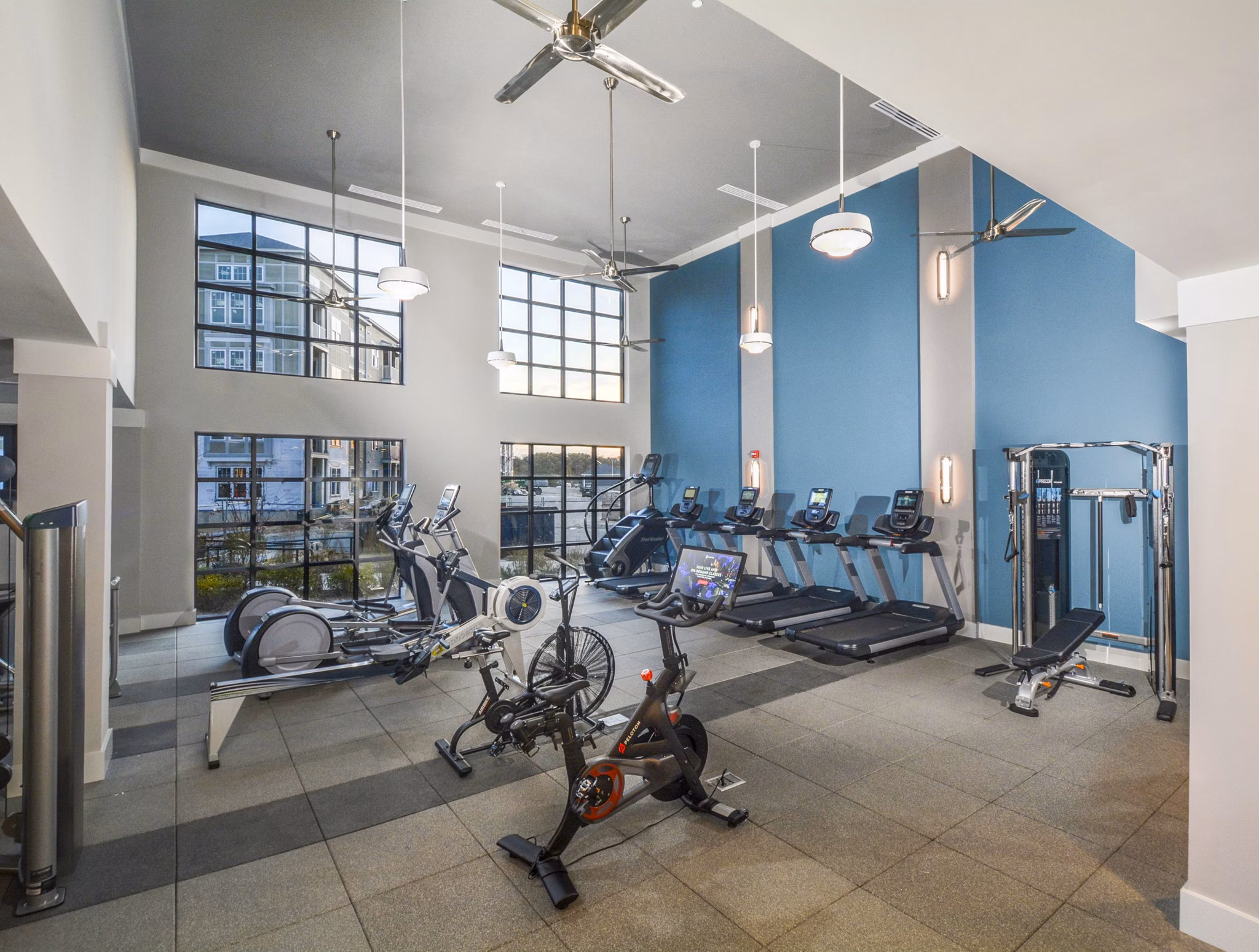 Fitness center with state-of-the-art equipment at The Wexley at 100 Apartments