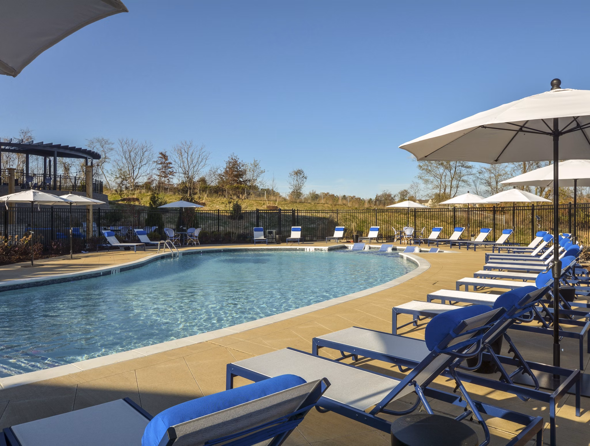 Luxurious poolside seating at The Wexley at 100 Apartments