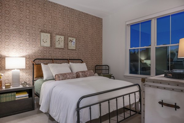 The Lodge Apartments: Cozy bedroom with modern design and neutral tones perfect for relaxation