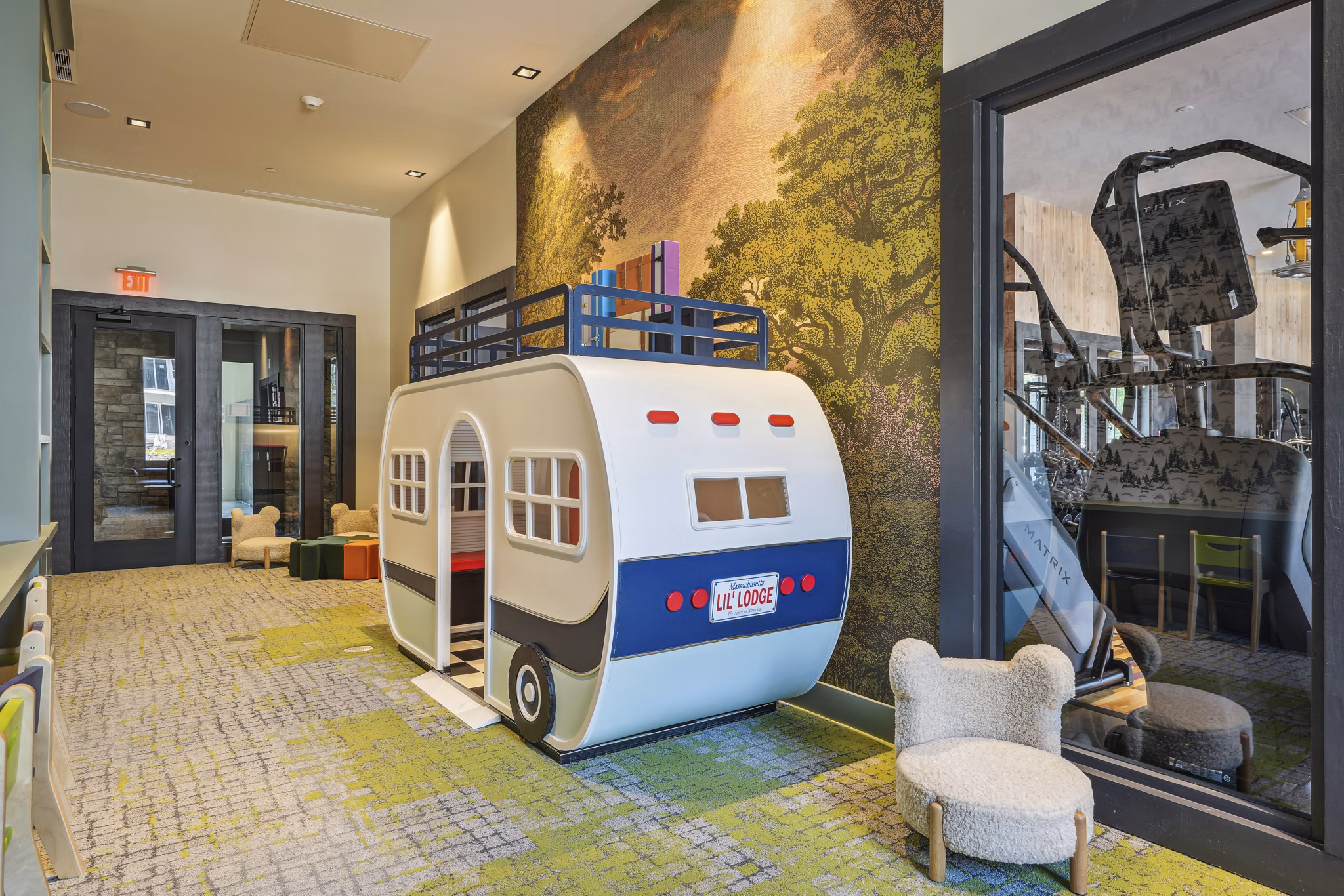 Clubhouse featuring modern seating and fireplace at The Lodge Apartments