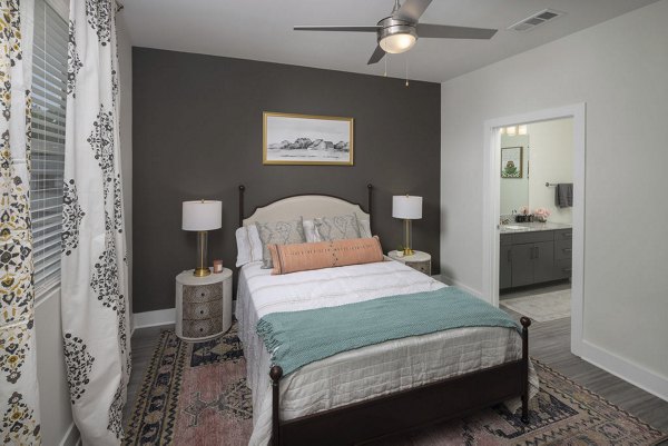 Modern bedroom with elegant furnishings at The Clara by Broadstone Apartments