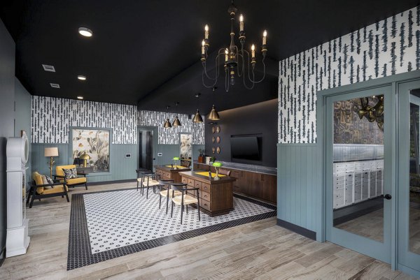 Clubhouse featuring modern decor and lounge area at The Clara by Broadstone Apartments