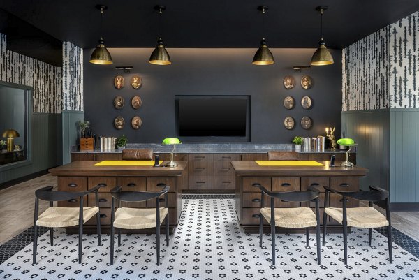 Clubhouse featuring cozy seating and modern design at The Clara by Broadstone Apartments