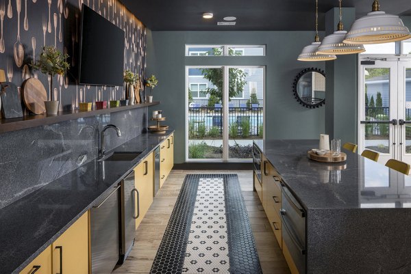 Clubhouse featuring modern design and cozy seating at The Clara by Broadstone Apartments