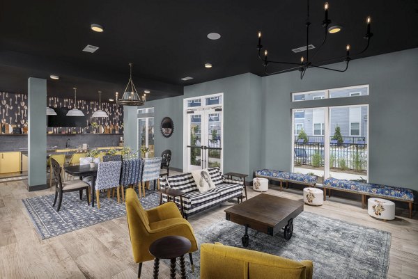 Elegant clubhouse with modern seating and decor at The Clara by Broadstone Apartments