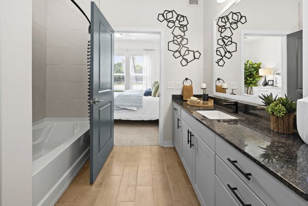 Modern bathroom with sleek fixtures at Flats at General Time Apartments