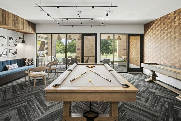 Game room featuring pool table and arcade machines at Flats at General Time Apartments