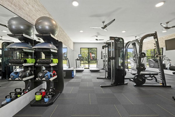 State-of-the-art fitness center with modern equipment at Flats at General Time Apartments for a healthy lifestyle