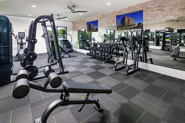 Fitness center featuring modern equipment at Flats at General Time Apartments