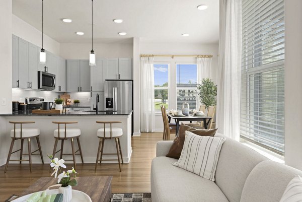 Spacious living room with modern furniture at Flats at General Time Apartments