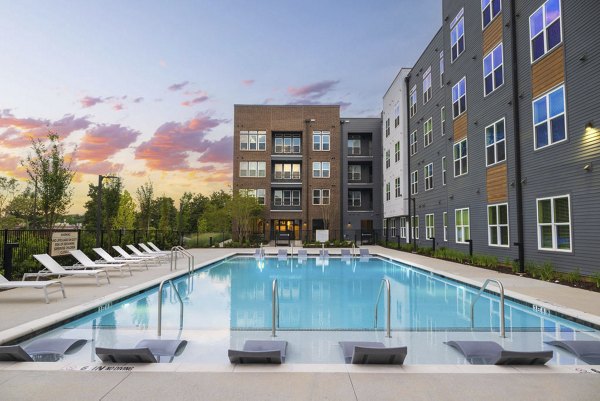 Rooftop infinity pool at Flats at General Time Apartments offers luxury and relaxation with skyline views Perfect urban oasis for residents