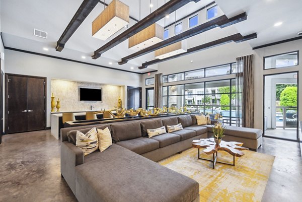 Modern clubhouse with stylish seating area at Domain at Midtown Park Apartments, ideal for social gatherings and events