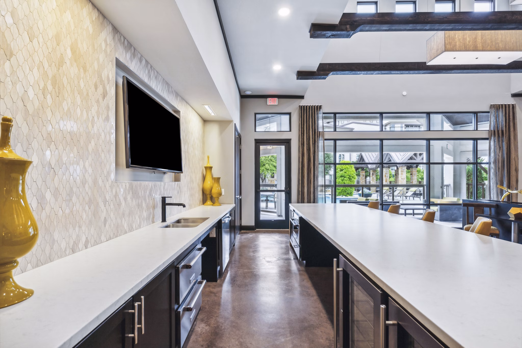 Clubhouse featuring sleek design and ample seating at Domain at Midtown Park Apartments, perfect for social gatherings or relaxation