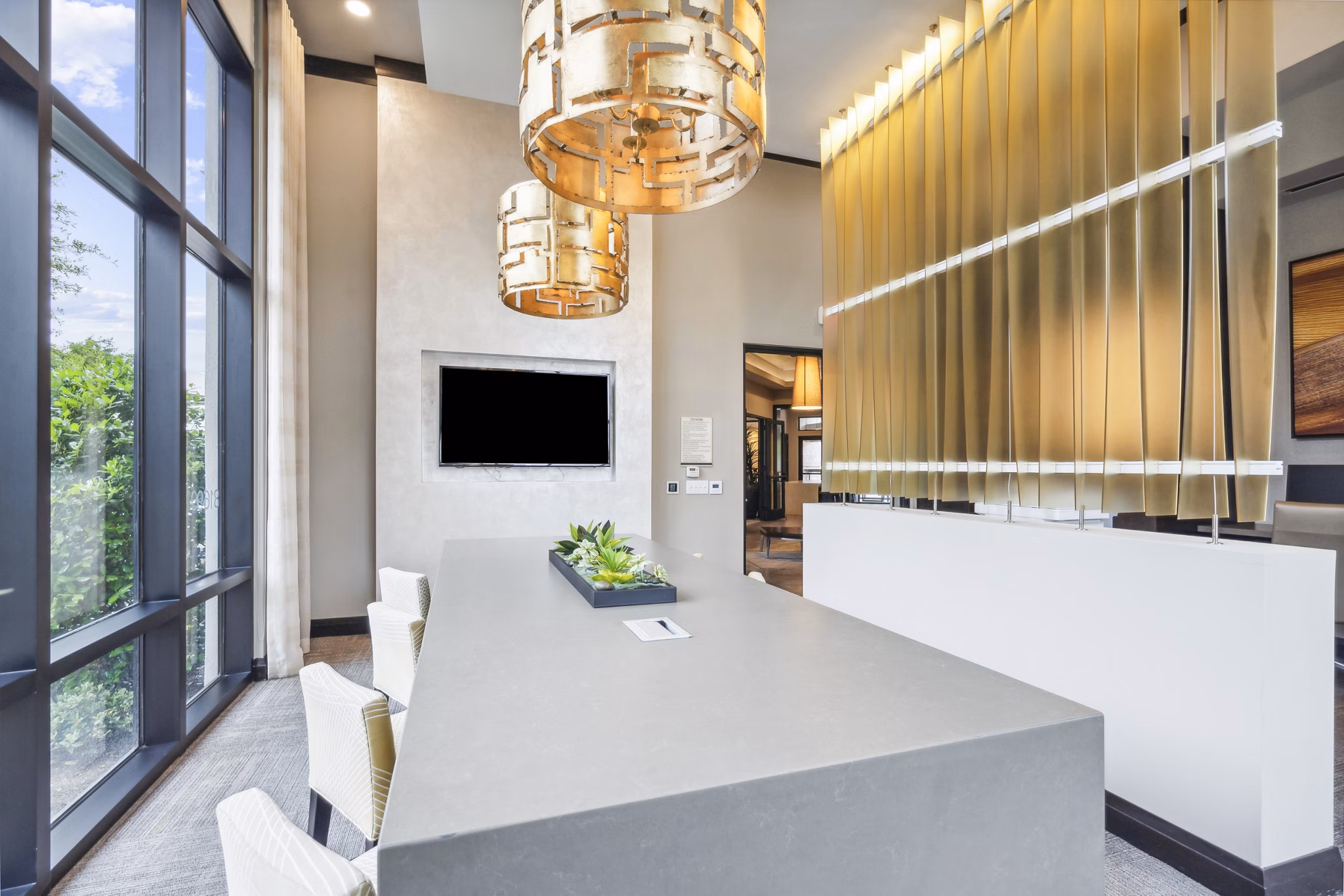 Modern clubhouse at Domain at Midtown Park Apartments featuring luxurious seating areas and elegant design for premium gatherings and social events