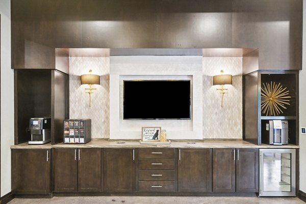 Modern clubhouse with stylish seating at Domain at Midtown Park Apartments, offering a luxurious community space for residents to relax and socialize