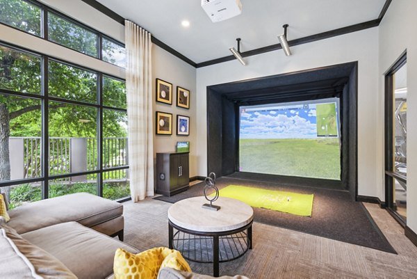 Virtual golf driving range at Domain at Midtown Park Apartments offers a unique leisure activity for residents in an upscale living community