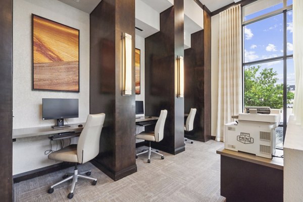 Business center with modern workstations at Domain at Midtown Park Apartments