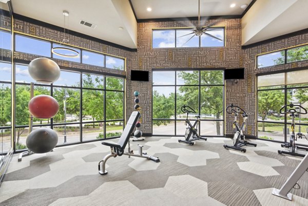 State-of-the-art fitness center featuring modern equipment at Domain at Midtown Park Apartments