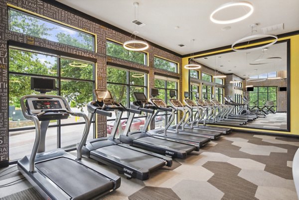 State-of-the-art fitness center featuring modern equipment at Domain at Midtown Park Apartments