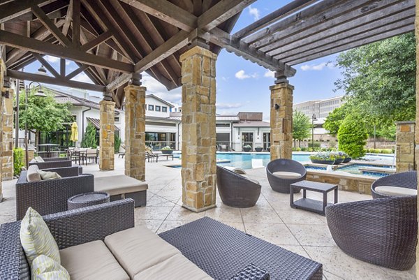 Domain at Midtown Park: Outdoor pool patio with lounge chairs and umbrellas at luxury apartments Perfect for relaxation and socializing