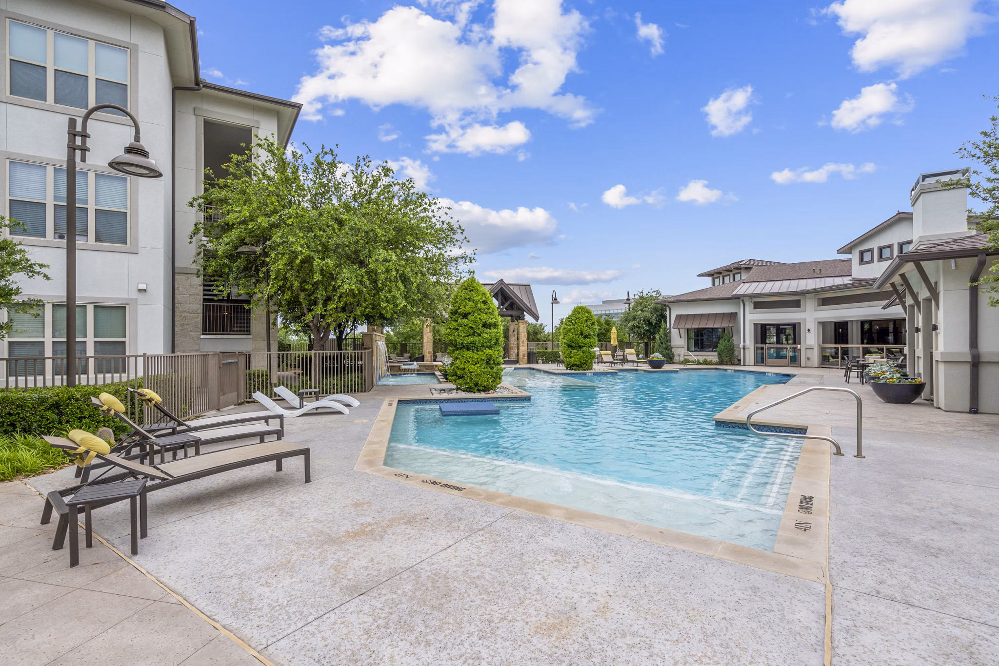 Rooftop pool with lounge chairs at Domain at Midtown Park luxury apartments