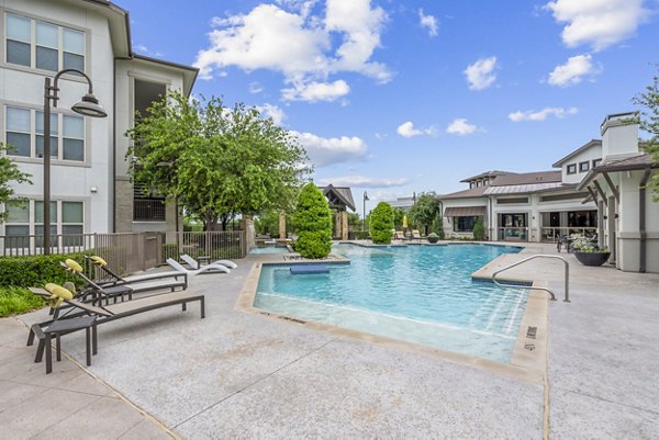 Rooftop pool with lounge chairs at Domain at Midtown Park luxury apartments