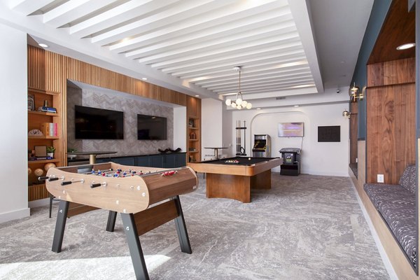 clubhouse game room at Lenox at the Grid Apartments