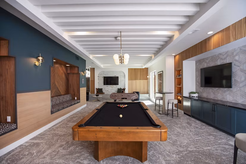 clubhouse game room at Lenox at the Grid Apartments