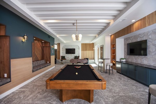 clubhouse game room at Lenox at the Grid Apartments