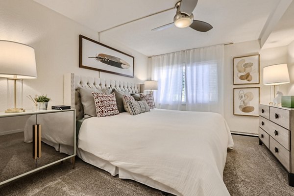 Avantus Apartments: Contemporary bedroom with stylish decor and ample sunlight in luxury Greystar community