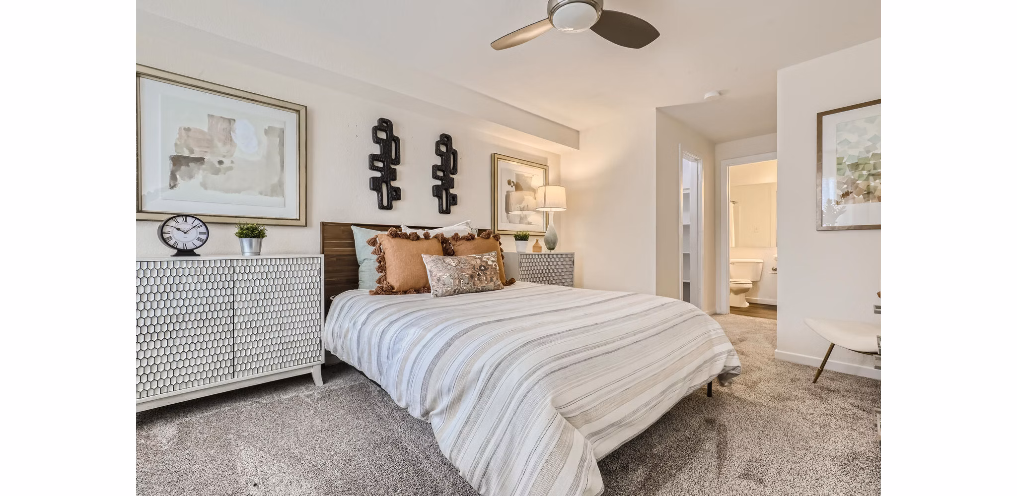 Cozy bedroom with elegant decor at Avantus Apartments offering luxury living in desirable Greystar community