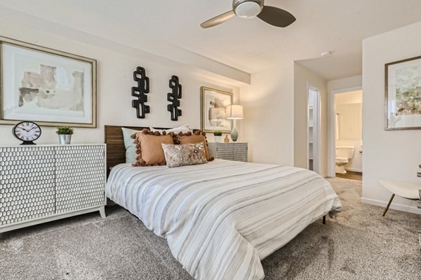 Cozy bedroom with elegant decor at Avantus Apartments offering luxury living in desirable Greystar community