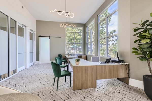 Modern clubhouse with stylish seating and entertainment spaces at Avantus Apartments