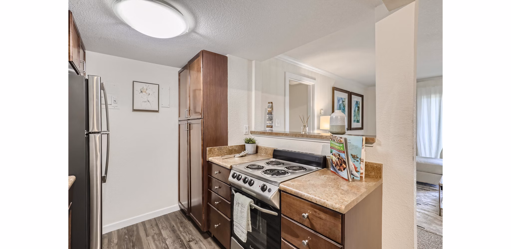 Avantus Apartments: Modern kitchen with sleek countertops and stainless steel appliances